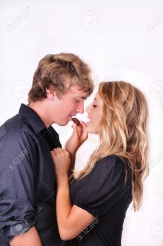 5154201-young-happy-couple-sharing-chocolate-candy-Stock-Photo